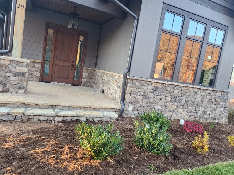 Stone veneer on a porch foundation and columns
